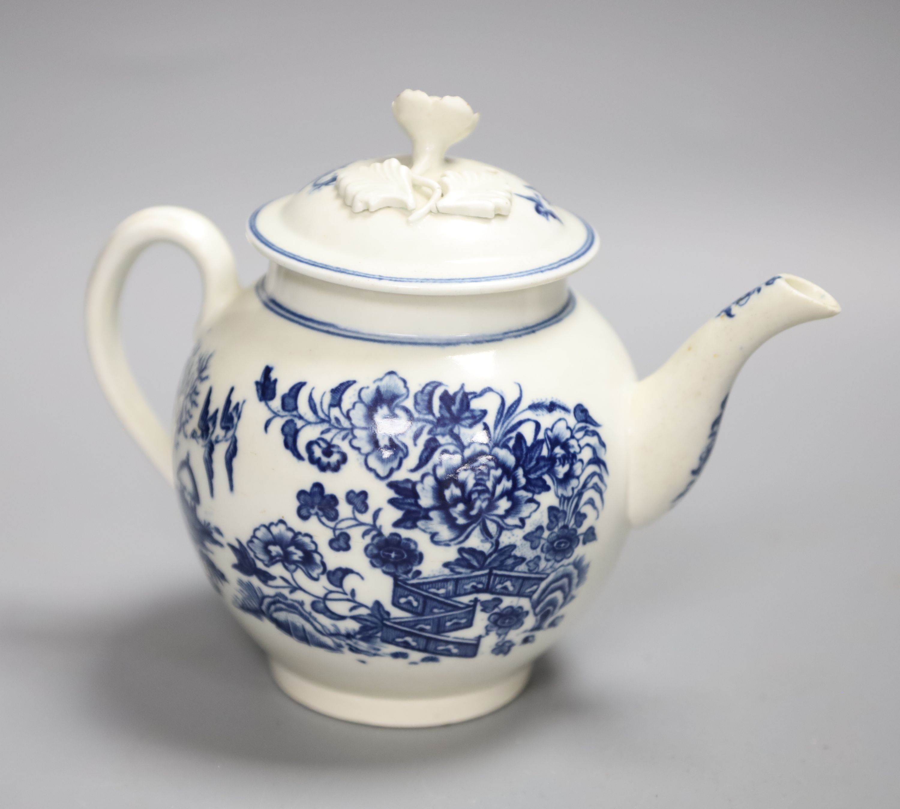 An 18th century Caughley tea pot and cover with the Fence in Blue pattern, C mark to base, height 13cm
